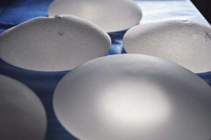 Close-up of implants on a blue table